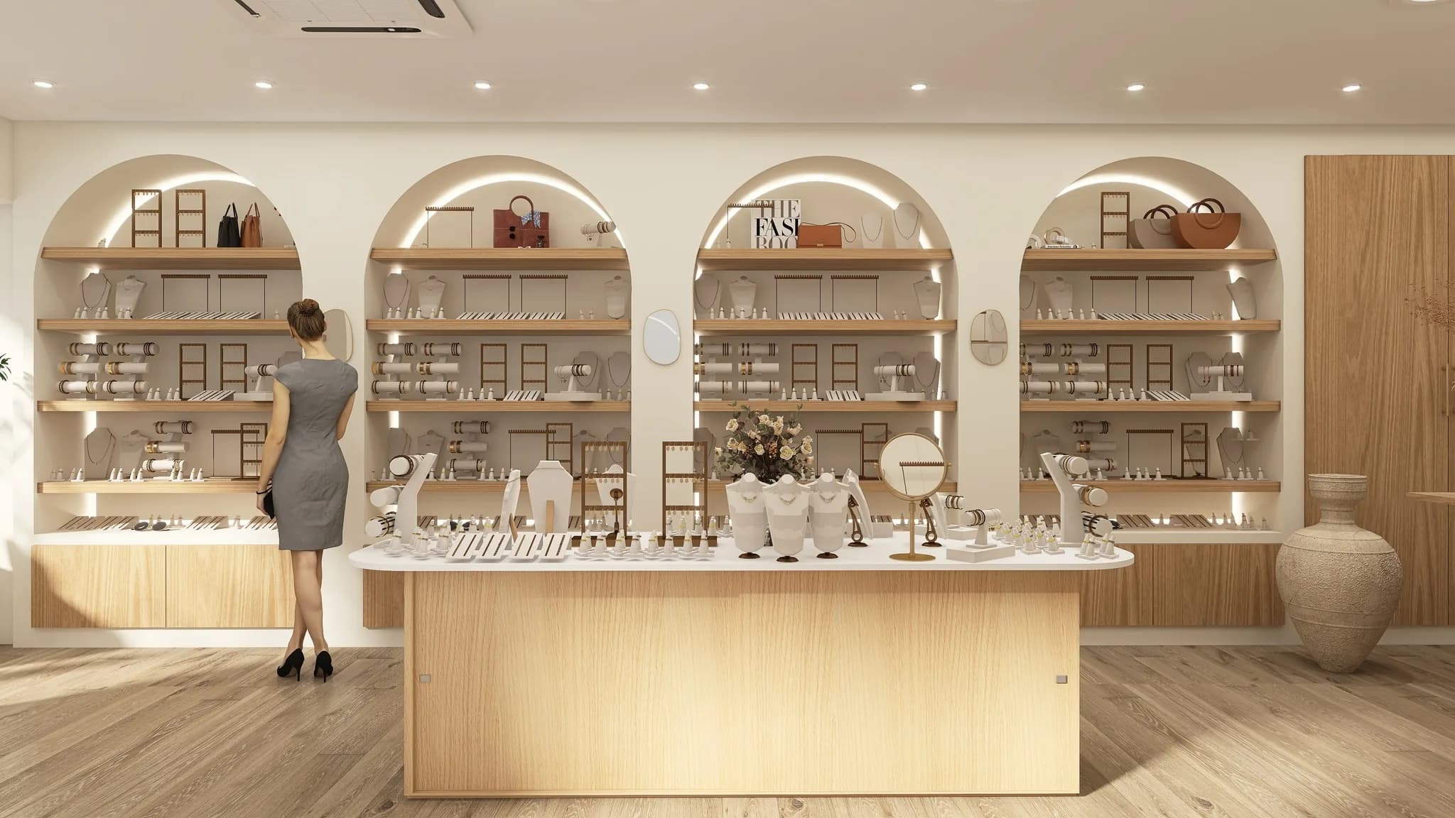 Rendu 3D d’une bijouterie : niches en arche éclairées garnies de bijoux, grand comptoir en bois clair.