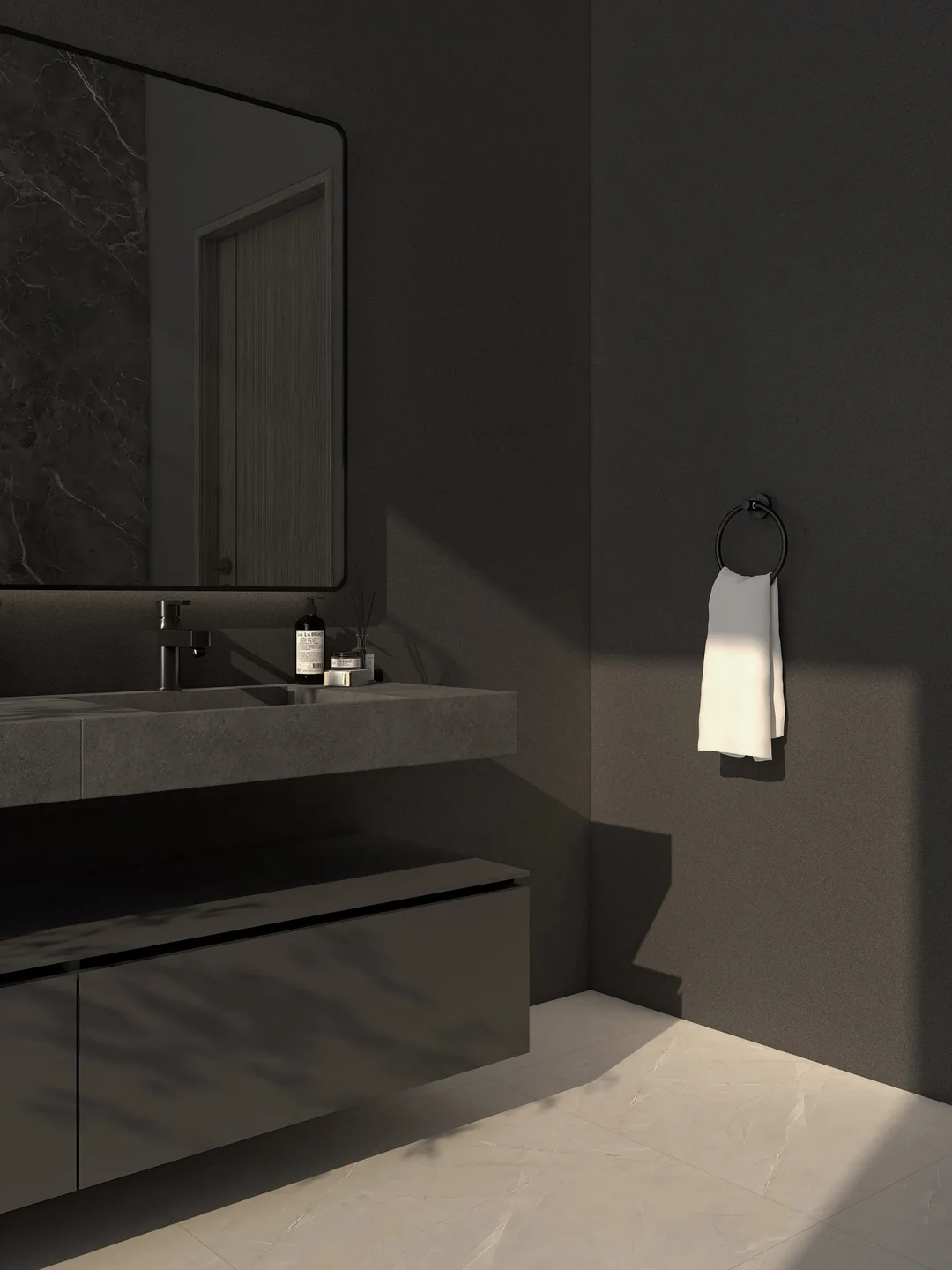 Rendu 3D d’une salle de bains sombre : plan vasque en pierre grise, miroir à cadre noir, anneau porte-serviette, serviette blanche.